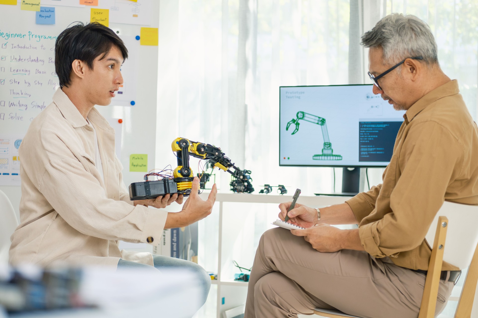engineering robot technology with asian programmer innovation and research teamwork in coding development